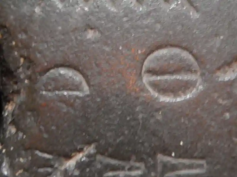 Solar disc and half-moon on a stone